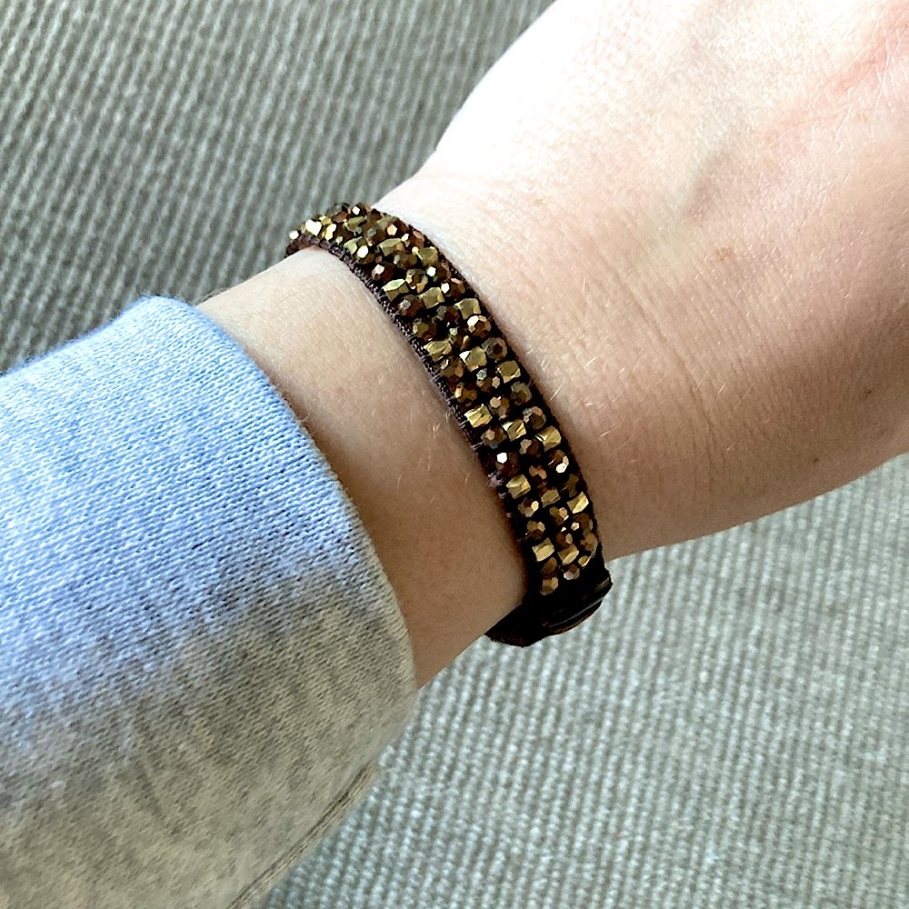 EUC brown, gold bead & leather bracelet. 
Purchased at boutique in Tulsa.